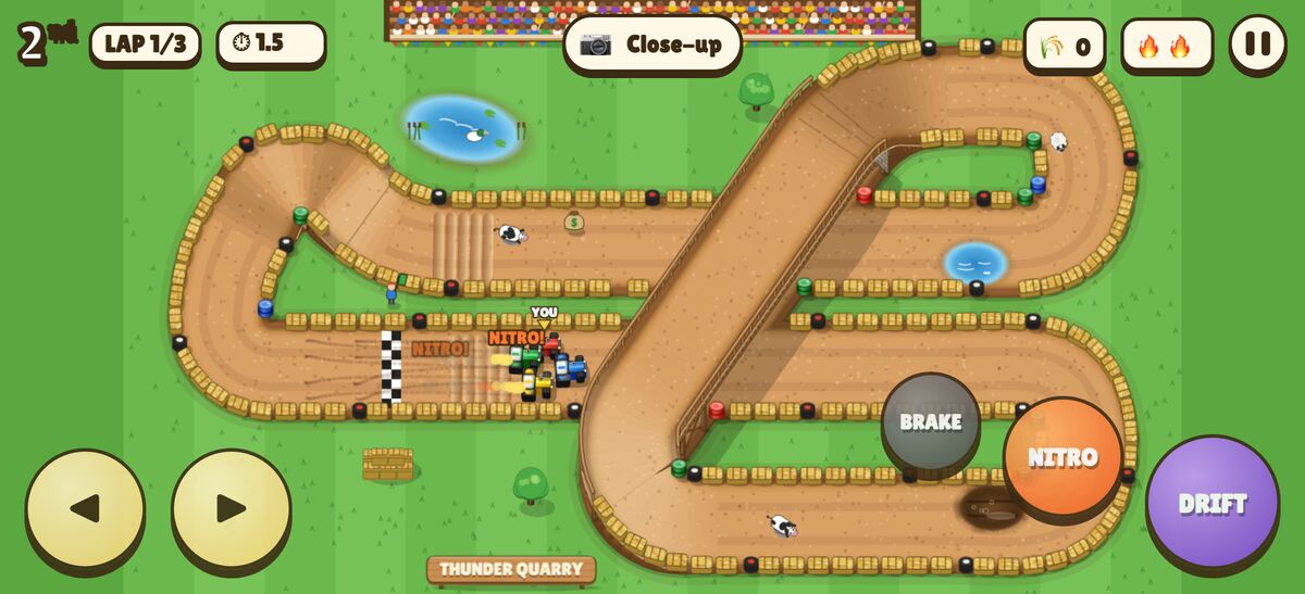 A race on a track with a wooden bridge over the road below